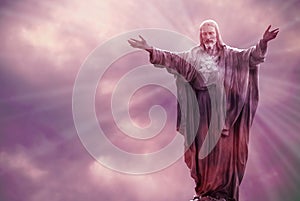 Jesus Christ statue against beautiful sky background