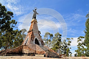 Jesus Christ statue on tower against sky, Sucre