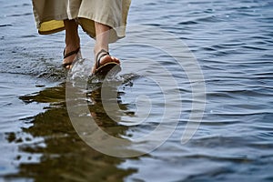 Jesus Christ walking on water at sea