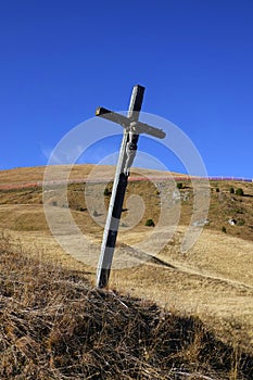 Jesus Christ on the wooden cross in Seceda area.