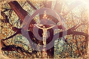 Jesus for crises on old linden tree old photo effect