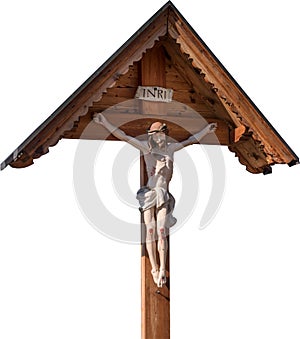 Jesus on the cross isolated on white background. Crucifiction. Wooden crucifix with effigy of Christ photo