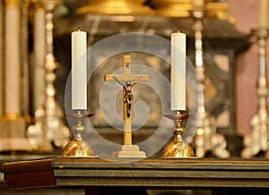 Old Crucifix, jesus on the cross in church with two candles