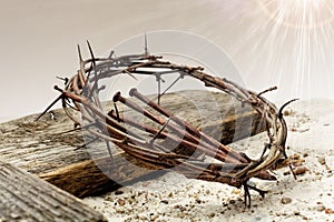 Jesus Crown Of Thorns and cross on sand. Vintage Retro Style.