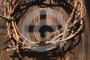 Jesus Crown Thorns and nails and cross on a wood background. Easter Day