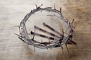 Jesus Crown Thorns and nails on Old and Grunge Wood Background. Vintage Retro Style.