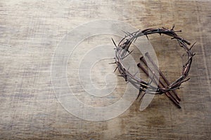 Jesus Crown Thorns and nails on Old and Grunge Wood Background. Vintage Retro Style. Free space for text