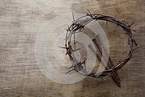 Jesus Crown Thorns and nails on Old and Grunge Wood Background. Vintage Retro Style. Free space for text