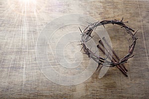 Jesus Crown Thorns and nails on Old and Grunge Wood Background. Vintage Retro Style. Free space for text