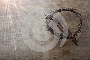 Jesus Crown Thorns and nails on Old and Grunge Wood Background. Vintage Retro Style. Free space for text