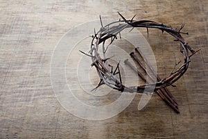 Jesus Crown Thorns and nails on Old and Grunge Wood Background. Vintage Retro Style. Free space for text