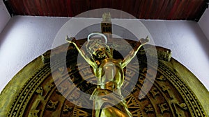 Jesus dying on the cross. Cross of Jesus inside Catholic Church. Concept of the Crucifixion of Christ. Camera movement