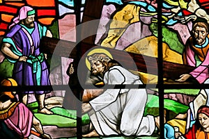 Jesus falls carrying the Cross - Stained Glass photo