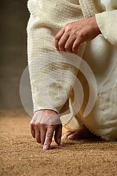 Jesus Finger Writing in the Sand photo