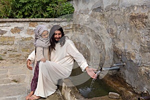 Jesus with a girl at a water well