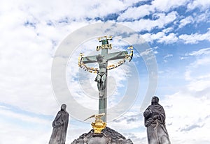 Jesus hanging on the cross in a statue. Inri sculpture.