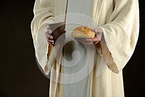 Jesus holding bread and a cup of wine