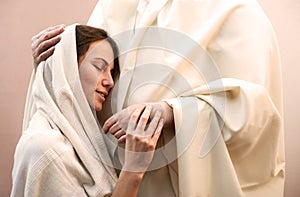 Jesus hugging a praying woman