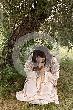 Jesus kneeling in agony at Gethsemane