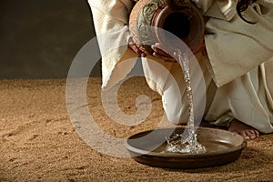 Jesus pouring water