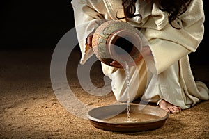 Jesus Pouring Water into Pan photo