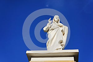 Jesus sculpture and blue sky