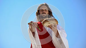 Jesus showing fish and bread, biblical story, miracle about feeding thousands