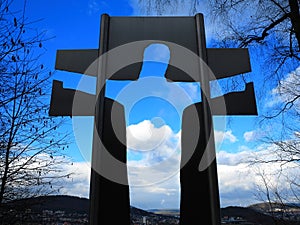 Jesus Christ silhouette in cross towards heaven Easter celebration photo