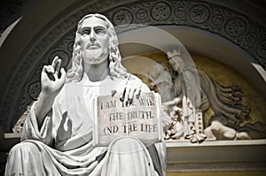 Jesus statue with the quote book