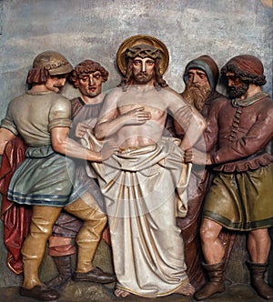 Jesus is stripped of His garments, 10th Stations of the Cross photo