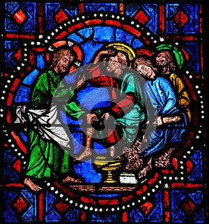 Jesus washing feet of Saint Peter on Maundy Thursday - Stained G photo