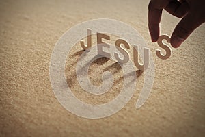 JESUS wood word on compressed board