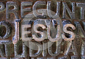Jesus written in metallic letters