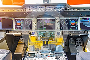 Jet airliner plane view inside the cockpit of the engine control panel, thrust and the main dashboard