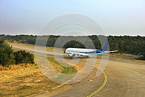 Jet airliner taxiing on the runway photo