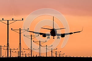 Jet Airplane Landing at Sunset