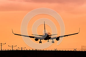 Jet Airplane Landing at Sunset