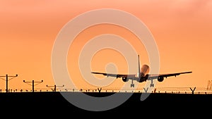 Jet Airplane Landing at Sunset