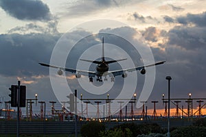 Jet Airplane Landing at Sunset