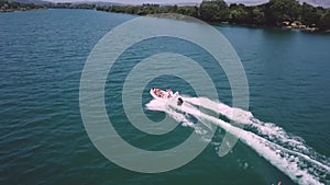 Jet boat pulling two people on a river Bojana