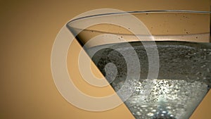 Jet Of Champagne Of Carbonated Drink Or An Alcoholic Cocktail Is Poured Into Glass