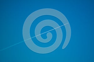 Jet in the deep blue sky