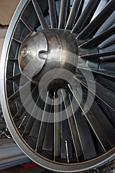 Jet engine intake with baffled and rotating steel structure