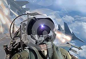 Jet fighter pilots looking around during air to air combat