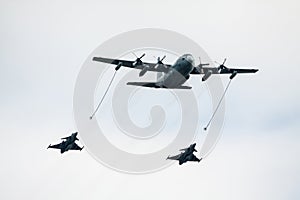 Jet fighters refueling in air photo