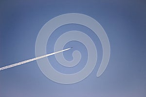 A jet flying in a clear blue sky