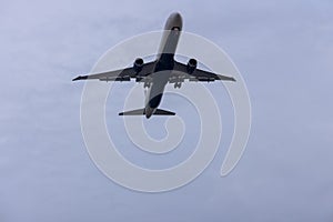 Jet plane seconds before landing on blue sky on a sunny day