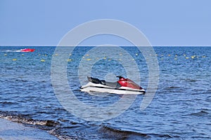 Jet ski anchored in the sea nearby.Hydrocycle at anchor. Jet ski anchored in the sea nearby. Hydrocycle at anchorat anchor