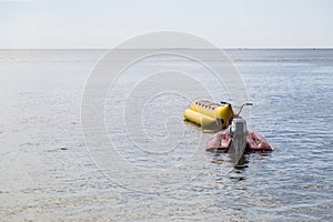 jet ski and banana boat floating on the sea