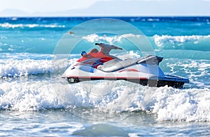 Jet Ski Moored inon on waves of Aegean sea photo
